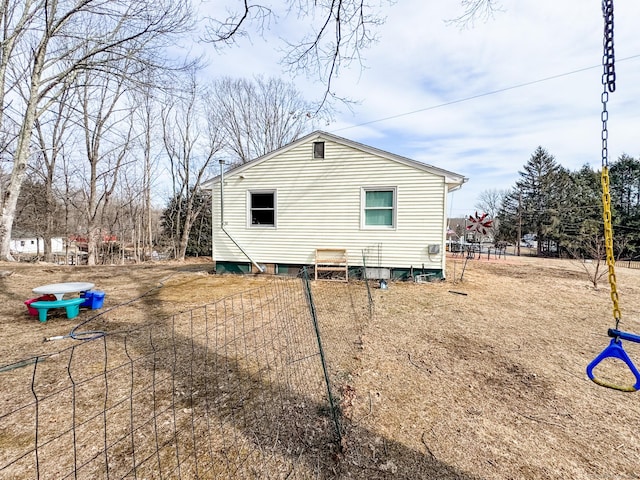 view of property exterior with fence