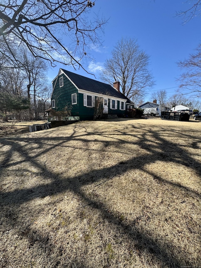 view of home's exterior with a chimney