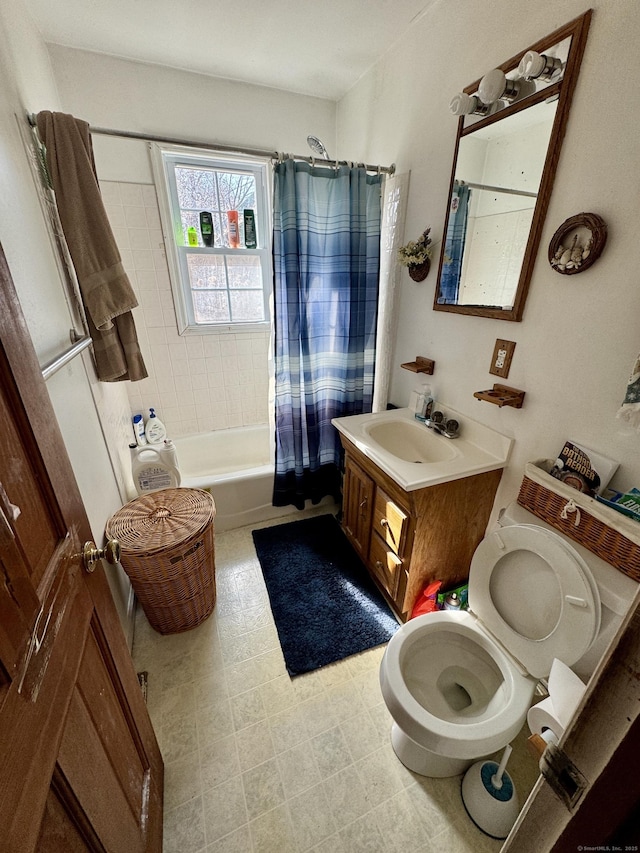 bathroom featuring toilet, vanity, and shower / bath combination with curtain