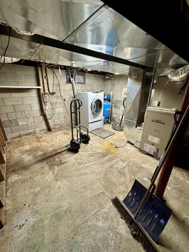 unfinished basement featuring washer / dryer