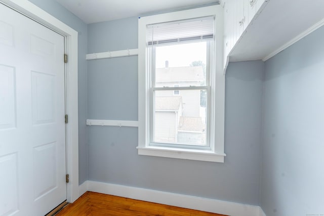 interior space featuring wood finished floors and baseboards