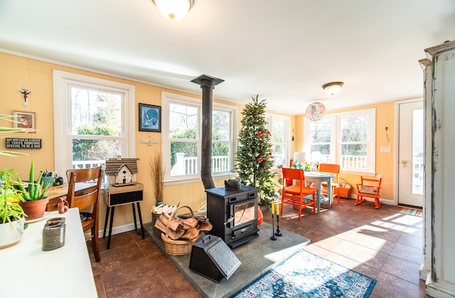 interior space featuring a wood stove and plenty of natural light