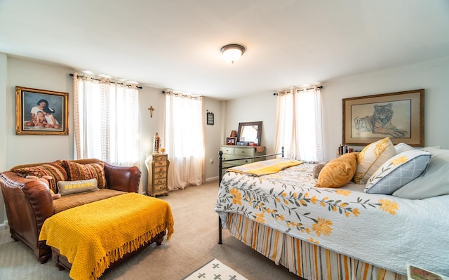 bedroom featuring light carpet