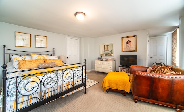 bedroom with carpet and baseboards