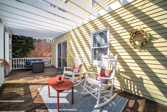 wooden deck featuring a pergola