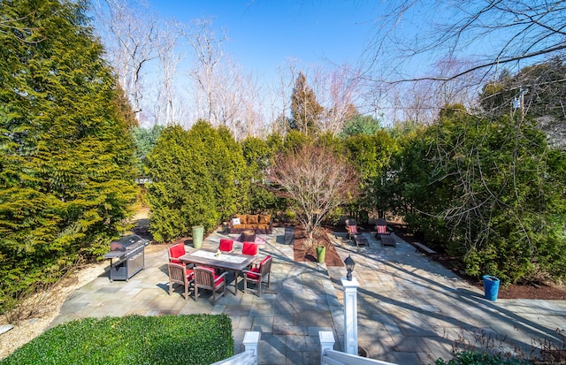 exterior space featuring grilling area and outdoor dining area