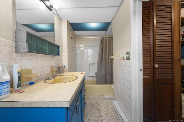 full bathroom with shower / tub combo with curtain, tile walls, a closet, vanity, and tile patterned floors