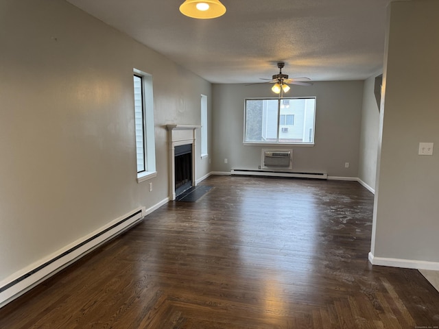 unfurnished living room featuring a baseboard heating unit, baseboards, ceiling fan, and a fireplace with flush hearth