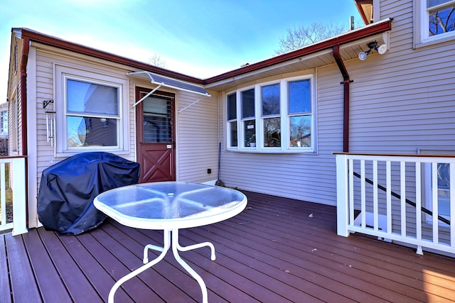 wooden deck featuring area for grilling