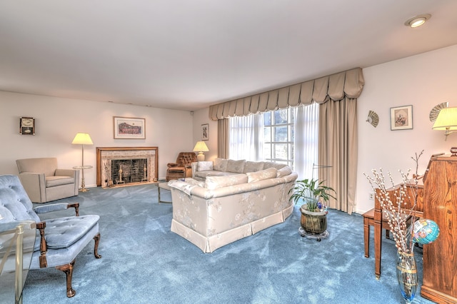 carpeted living room with a fireplace with raised hearth