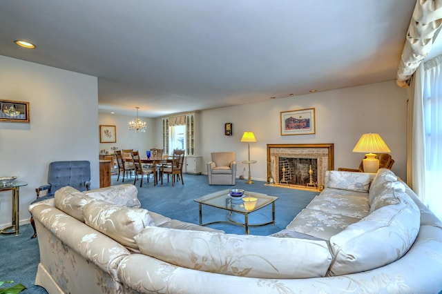 carpeted living area featuring recessed lighting, baseboards, a chandelier, and a fireplace