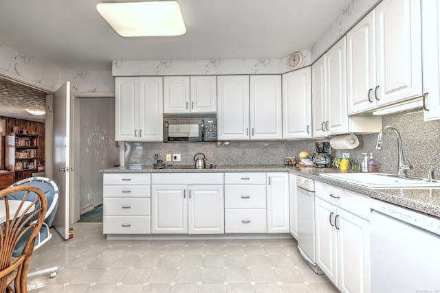 kitchen featuring a sink, wallpapered walls, white cabinets, white dishwasher, and black microwave