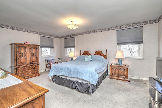 bedroom with carpet, baseboards, and baseboard heating