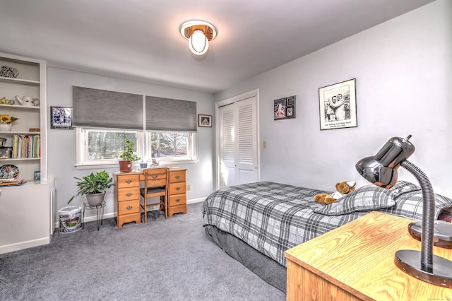 bedroom featuring carpet, a closet, and baseboards