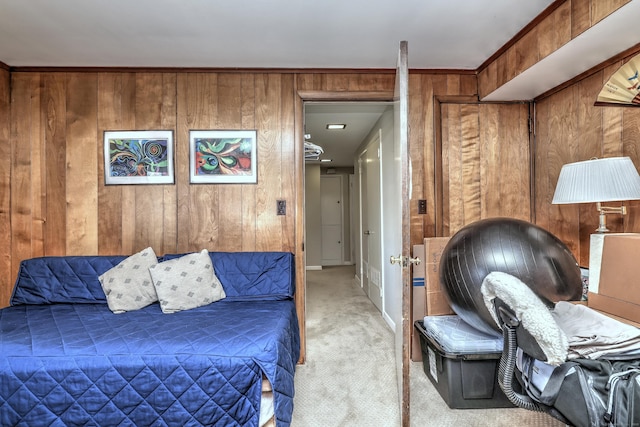 carpeted bedroom with wooden walls