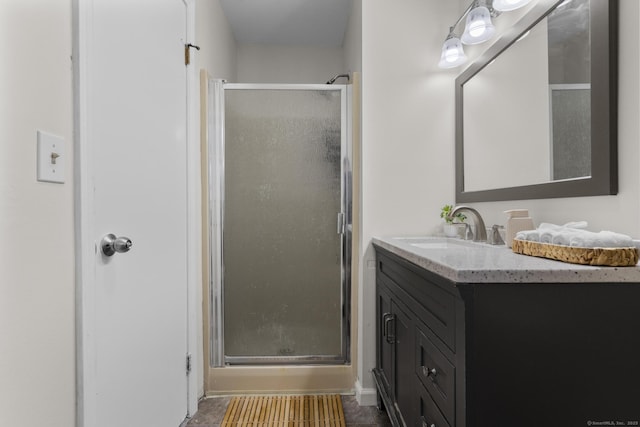 full bathroom featuring a stall shower and vanity