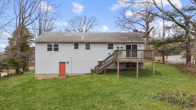 back of house with a chimney, stairway, a lawn, and a wooden deck