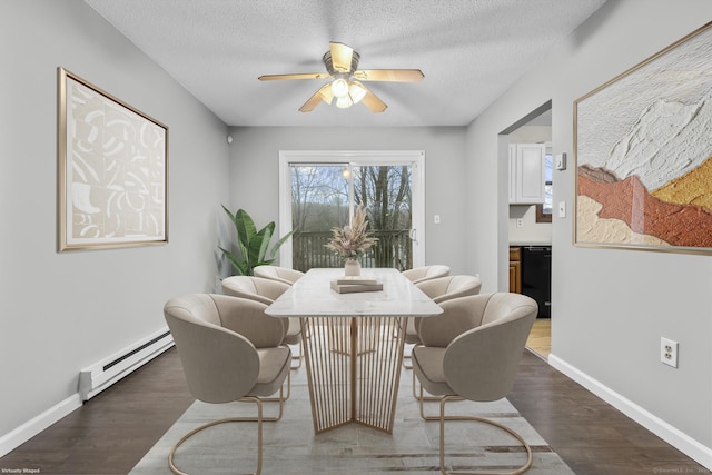 dining room with dark wood-style floors, a baseboard radiator, a textured ceiling, and baseboards