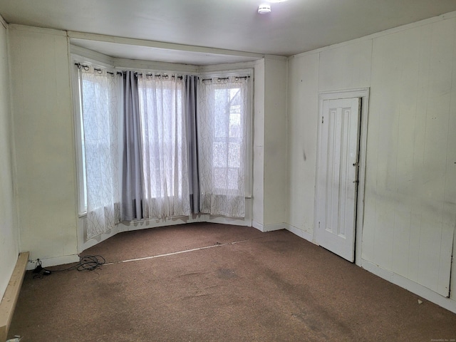 unfurnished room featuring a baseboard heating unit