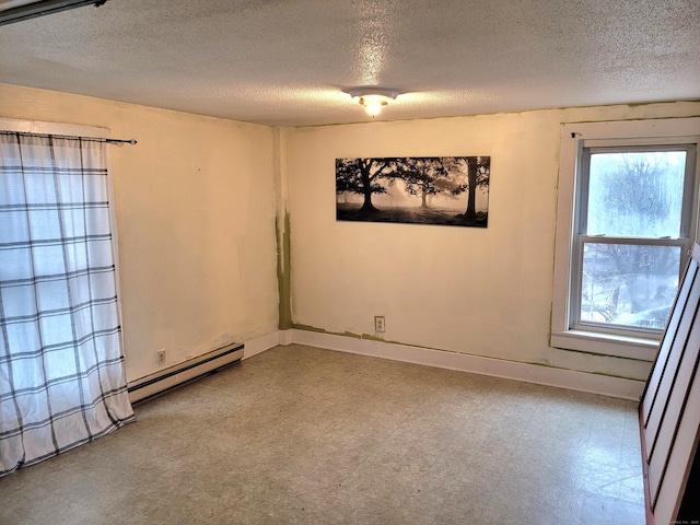 unfurnished room featuring a baseboard radiator, a textured ceiling, baseboards, and tile patterned floors