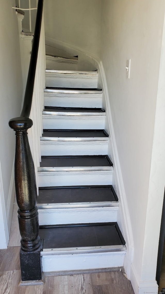 stairs featuring baseboards