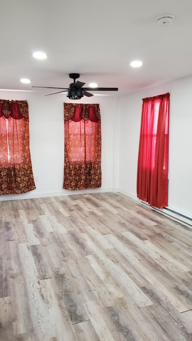 unfurnished living room with a ceiling fan, recessed lighting, and wood finished floors