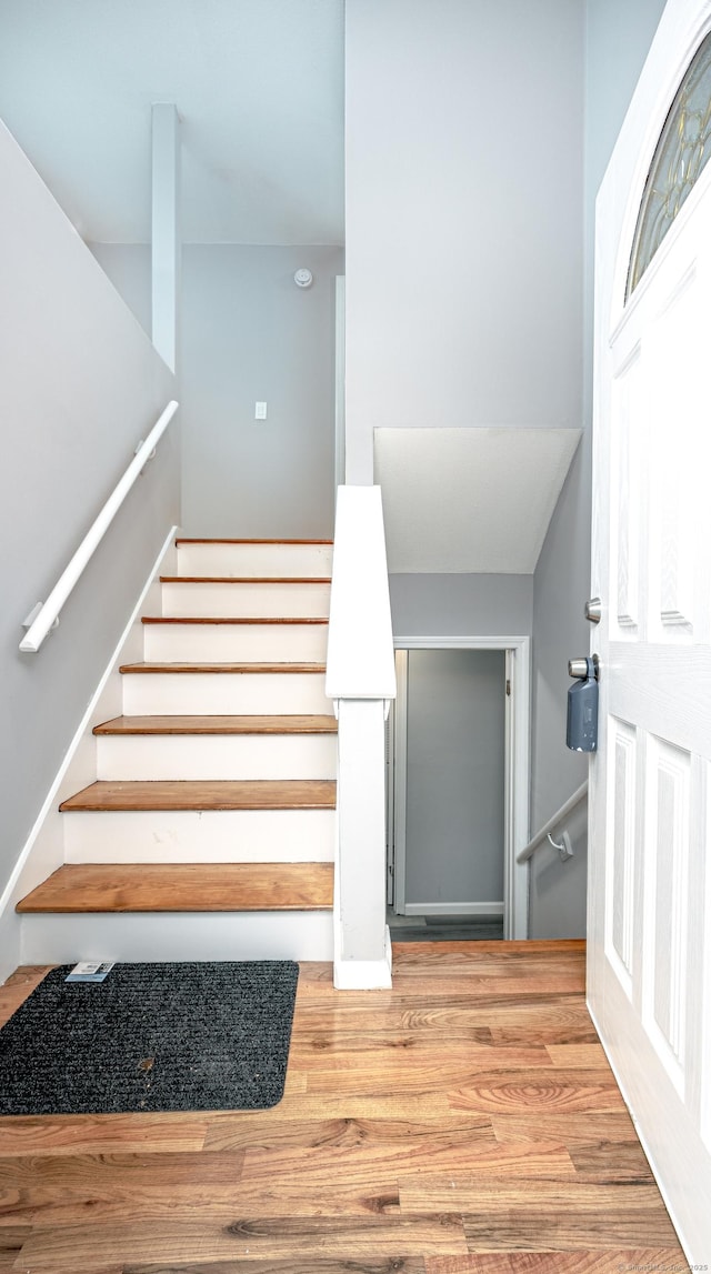 staircase featuring wood finished floors