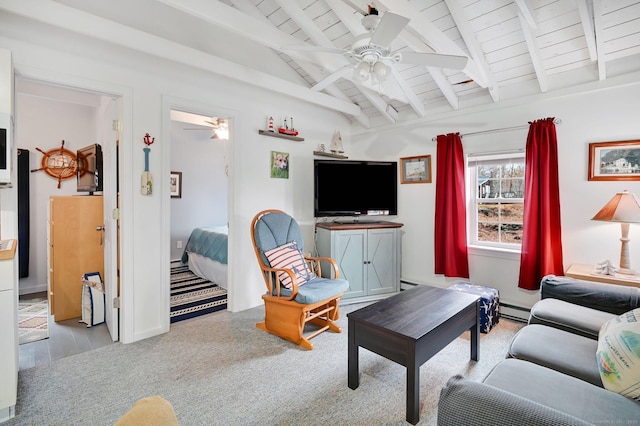 living area featuring ceiling fan, vaulted ceiling with beams, wooden ceiling, baseboard heating, and carpet