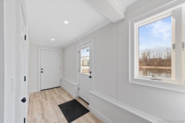 entryway featuring ornamental molding, recessed lighting, baseboards, and light wood finished floors