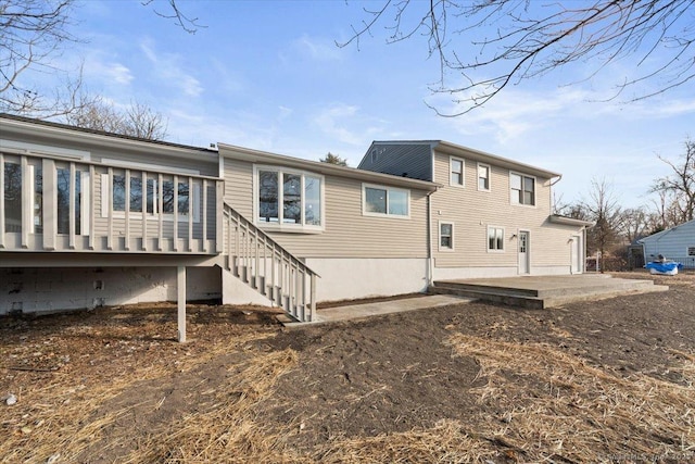 back of property featuring a patio