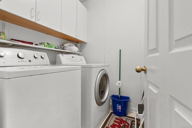 laundry area with cabinet space and washer and dryer