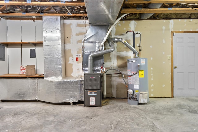 utility room featuring water heater