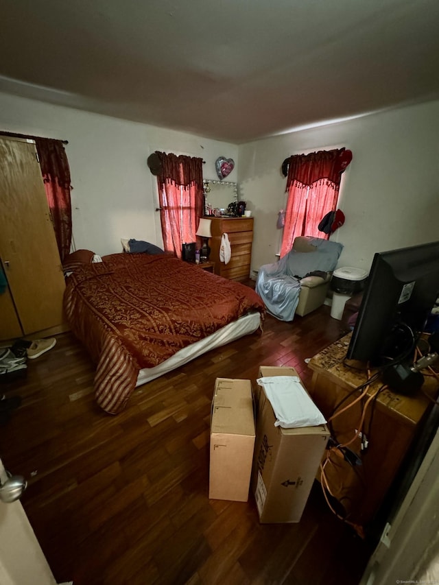 bedroom with wood finished floors