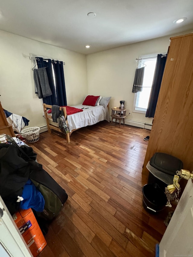 bedroom with hardwood / wood-style flooring and recessed lighting