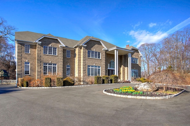 view of front of home featuring brick siding