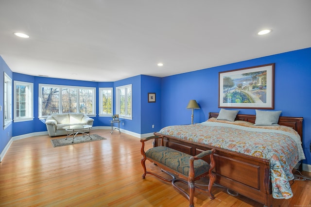 bedroom featuring recessed lighting, wood finished floors, and baseboards