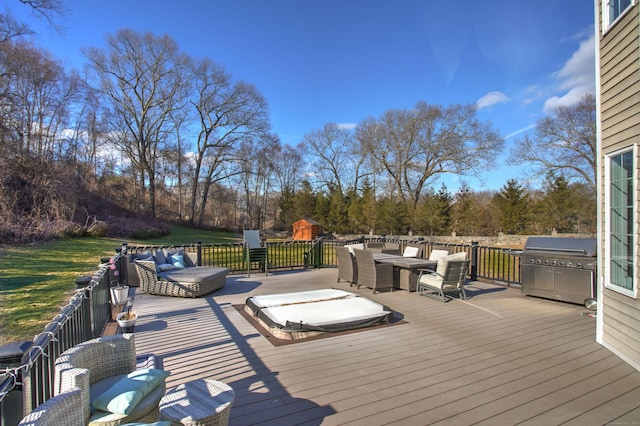 wooden terrace with outdoor dining area and grilling area