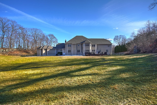 back of property featuring a yard