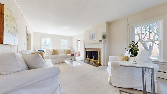 living area with a fireplace with raised hearth and ornamental molding