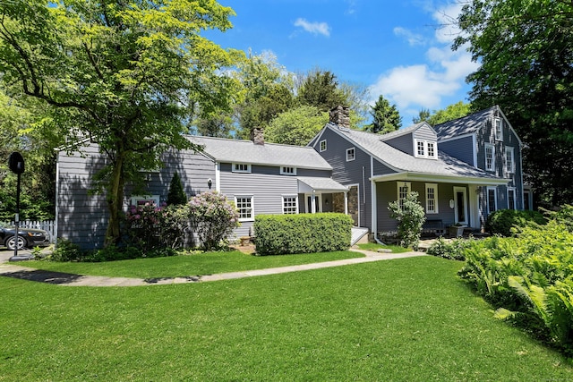 64 Old Kings Hwy S, Darien, CT 06820 - view of front of home featuring a front yard and a chimney