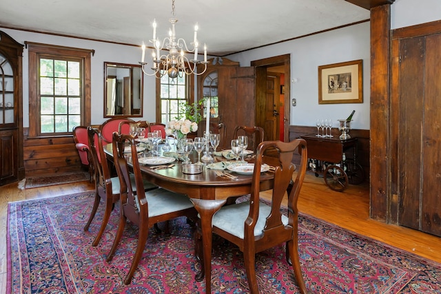 64 Old Kings Hwy S, Darien, CT 06820 - dining space featuring a chandelier, wood finished floors, ornamental molding, and wainscoting