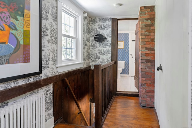 64 Old Kings Hwy S, Darien, CT 06820 - hall with radiator heating unit, wood finished floors, and wallpapered walls
