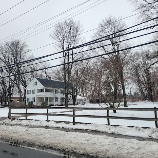 view of front of house with a fenced front yard and a chimney