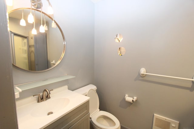 bathroom featuring visible vents, vanity, and toilet