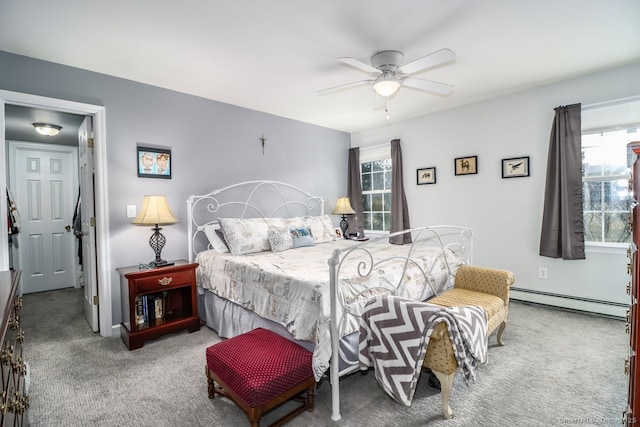 bedroom with a ceiling fan, a baseboard radiator, and carpet