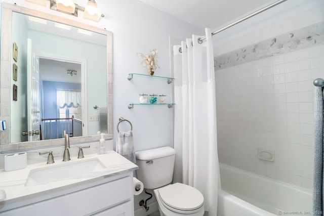 bathroom featuring shower / bath combo, vanity, and toilet