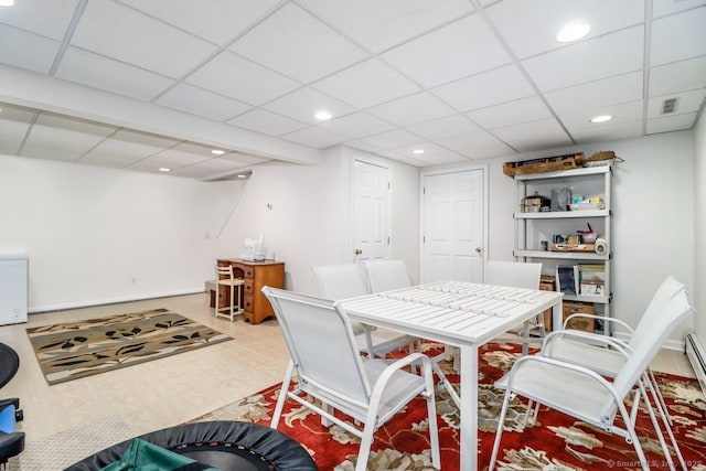 dining room featuring baseboards, visible vents, a drop ceiling, and recessed lighting