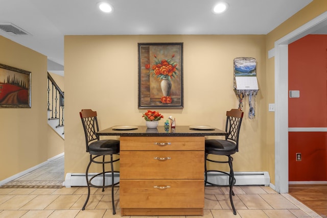 dining room featuring stairs, a baseboard radiator, visible vents, and recessed lighting