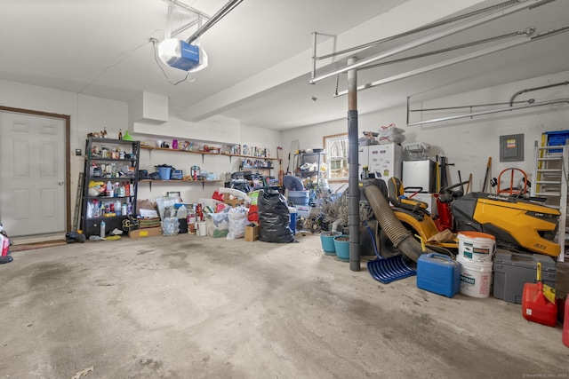 garage with a garage door opener and electric panel