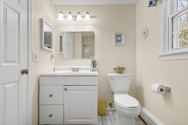 bathroom featuring vanity, a baseboard radiator, tile patterned flooring, and toilet